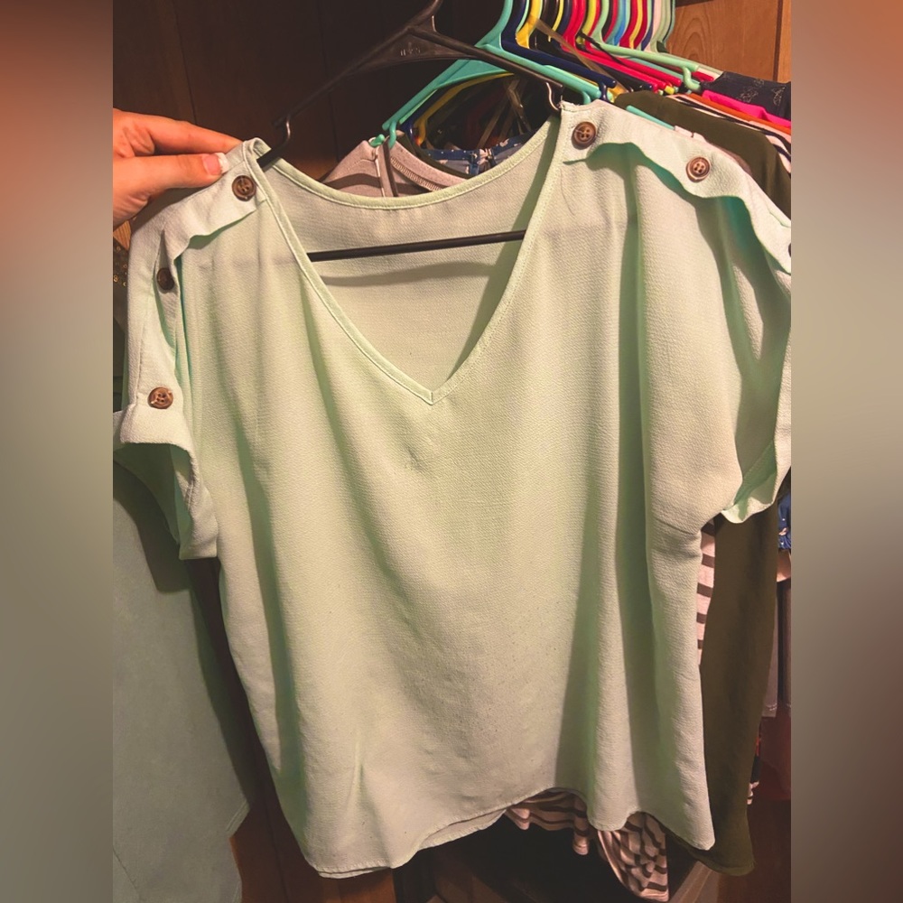 Mint color blouse with buttons on sleeves